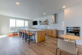 Club room with commercial grade appliances, billiards and shuffle board for resident events at Riverfront Everett, Washington, 98101